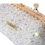 Detail view of the Aurélia Crystal gold handle and handcrafted beadwork
