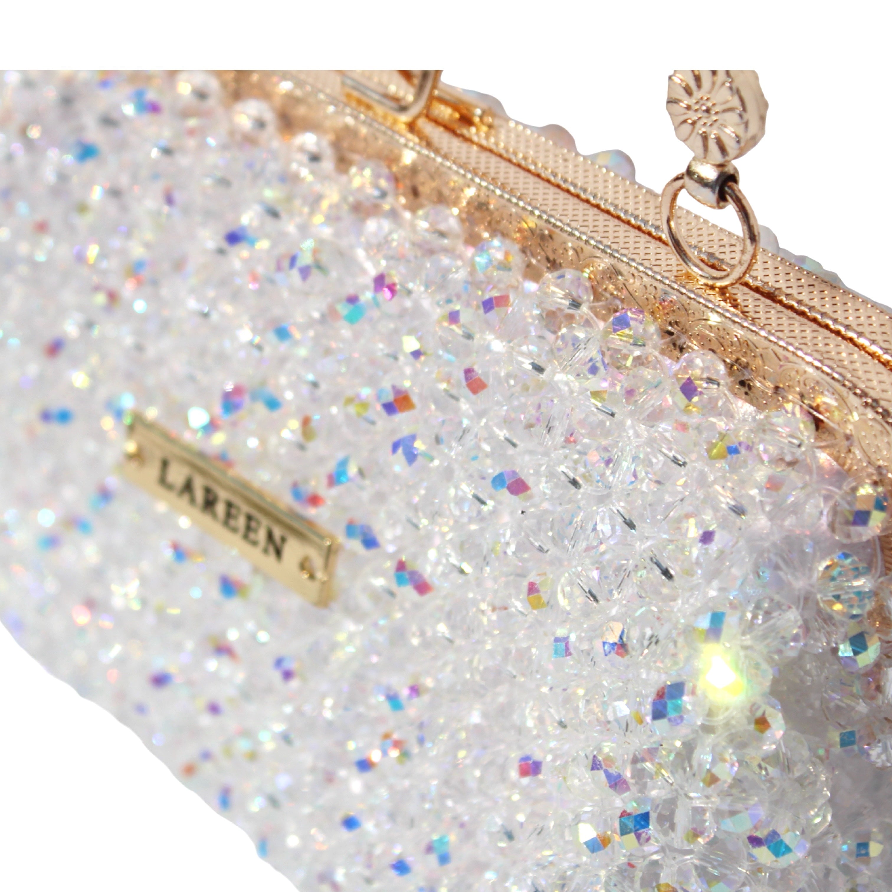 Detail view of the Aurélia Crystal gold handle and handcrafted beadwork