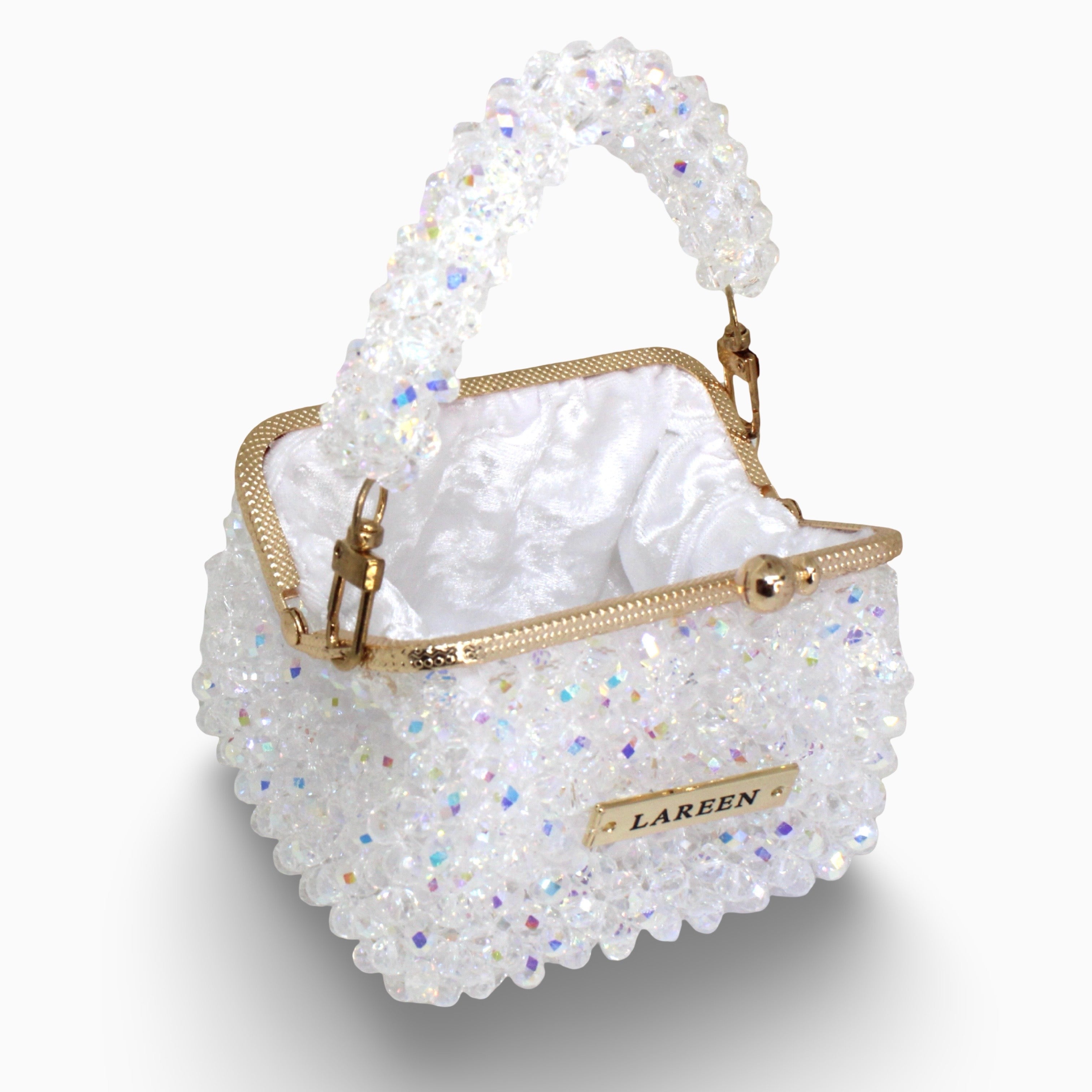 Aurélia Crystal Mini open, showing the interior and gold frame