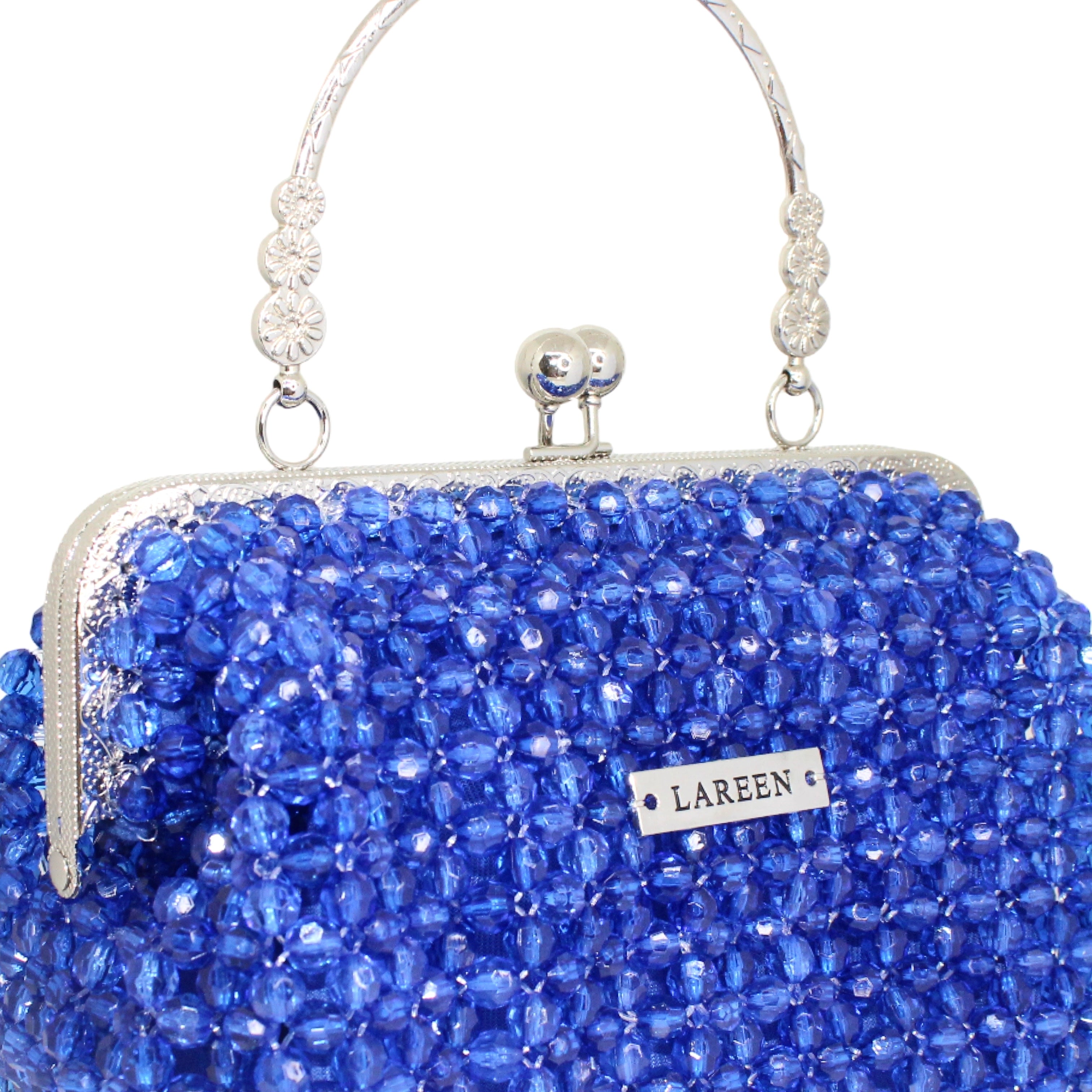 Close-up of deep blue beadwork on Aurélia Saphir